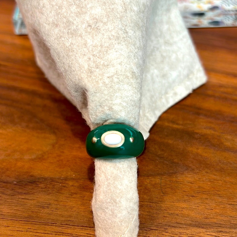 Green enamel ring with white center stone. Size 6